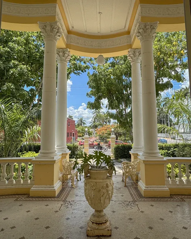 View from the Corinthian-column portico toward the garden and the street